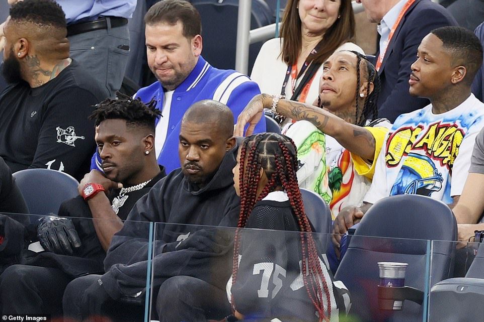 Kanye West with daughter North West (right) and Antonio Brown, an NFL player who is president of the rapper's sports enterprise Donda Sports, at Super Bowl LVI between the Los Angeles Rams and the Cincinnati Bengals