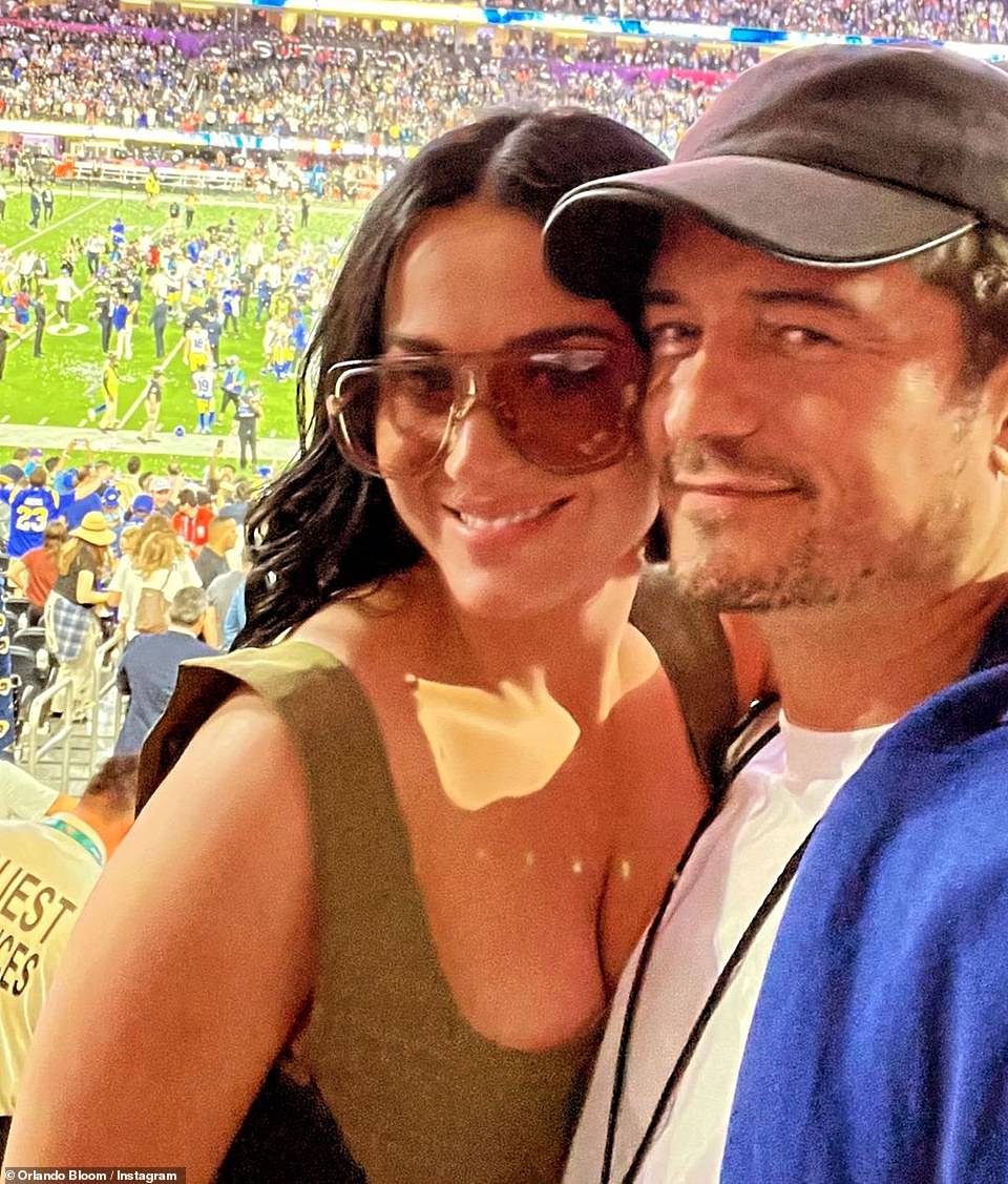 Katy Perry and Orlando Bloom pose for a photograph together at the Super Bowl in Los Angeles