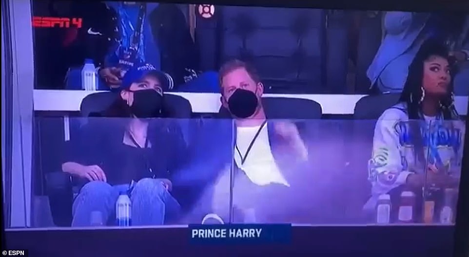 Prince Harry was also sat next to LA singer Mila J (right), the older sister of Jhene Aiko who performed America The Beautiful