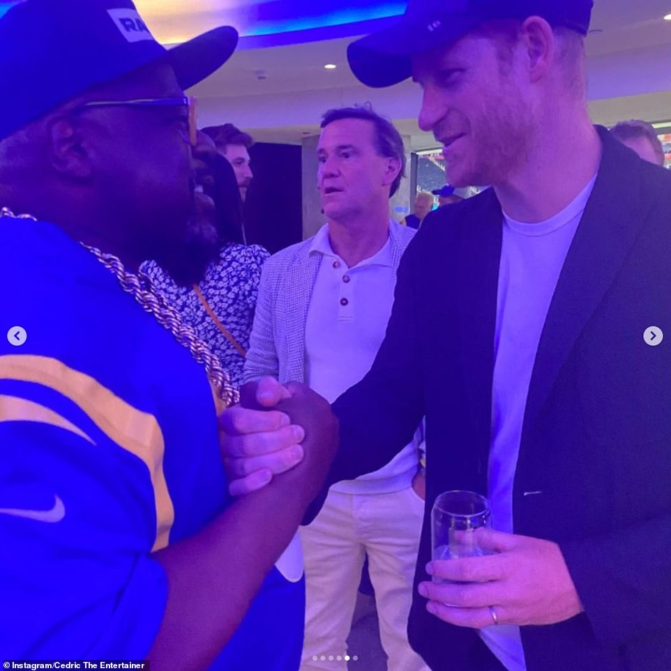Prince Harry appeared to break Los Angeles mask rules at the Super Bowl while meeting Cedric the Entertainer backstage at the Super Bowl on Sunday, as he greeted the actor having removed his face covering that he had been wearing while seated