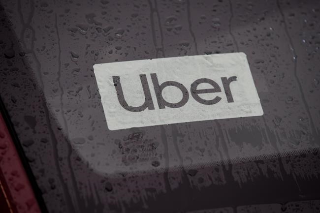 An Uber driver's vehicle is seen in Vancouver on Jan. 24, 2020. The United Food and Commercial Workers Union Canada, representing Toronto drivers for Uber Technologies Inc.’s premium Black service says it has reached a settlement in a case it was pursuing to help the workers unionize. THE CANADIAN PRESS/Darryl Dyck