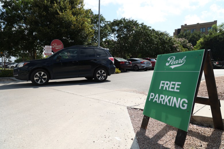 A vehicle exits the free parking lot at the Pearl Saturday.
