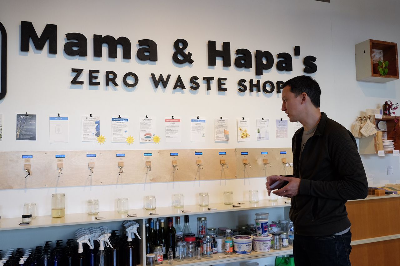 - Ross Ching, founder of the Mama & Papa's zero waste store, checks the technology he built to count the volume of product dispensed by a customer at the company's outpost on North Mississippi Avenue on June 7, 2022.
